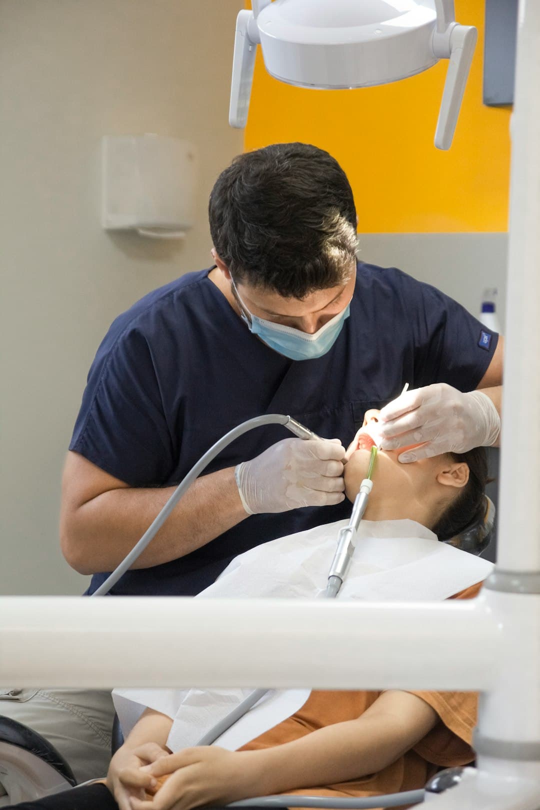 Dentist performing thorough dental cleaning