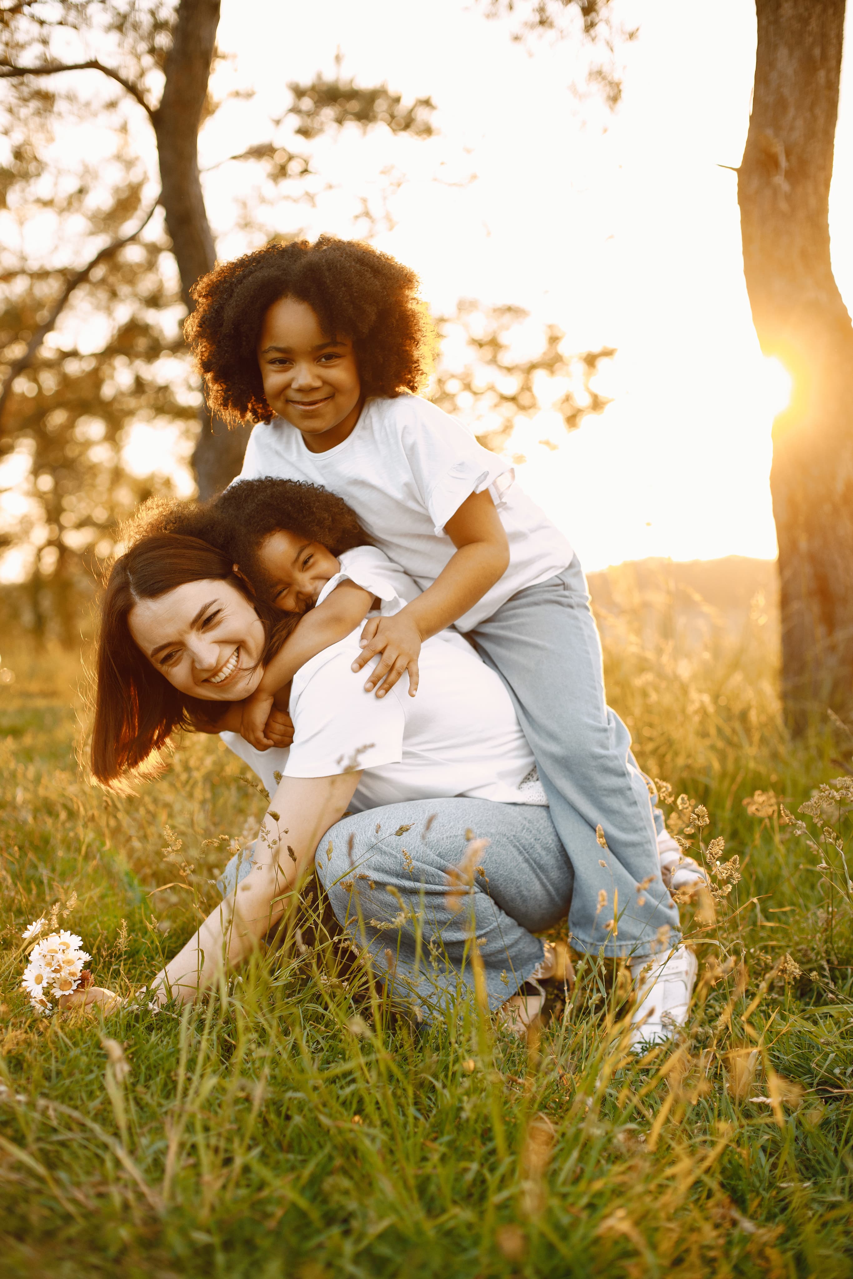 Mother and daughter smiling together outdoors